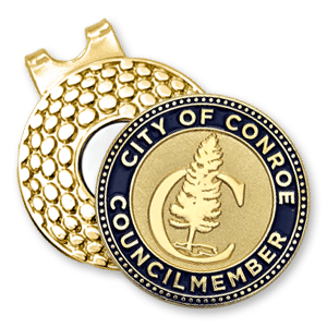 A gold custom golf ball marker by Lone Star Challenge Coins